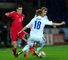 Bale is shackled by two Finnish players at the Millennium Stadium