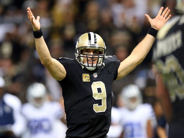 Drew Brees celebrates a fine day at the office for the Saints