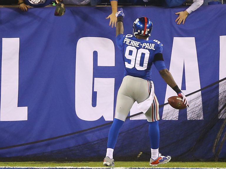 Jason Pierre-Paul celebrates his touchdown against the Packers