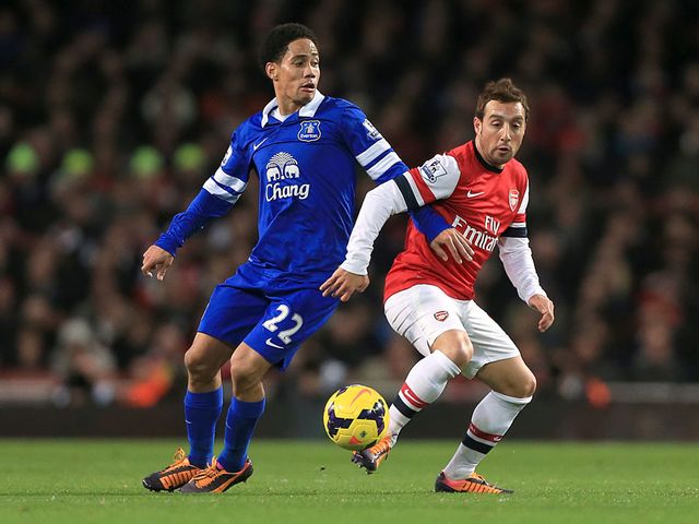 Steven Pienaar and Santi Cazorla battle for the ball