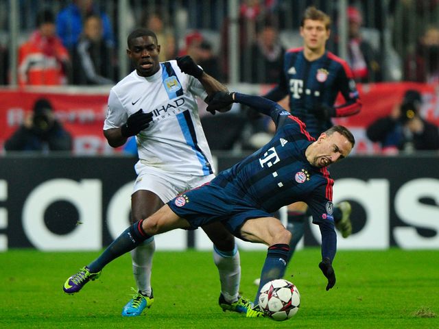 Franck Ribery is knocked over by Micah Richards