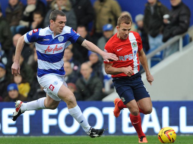 Richard Dunne and Jordan Rhodes battle for possession