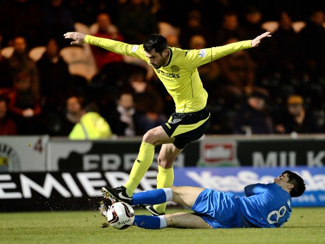 Steven Thompson tries to avoid a challenge from Ian McShane