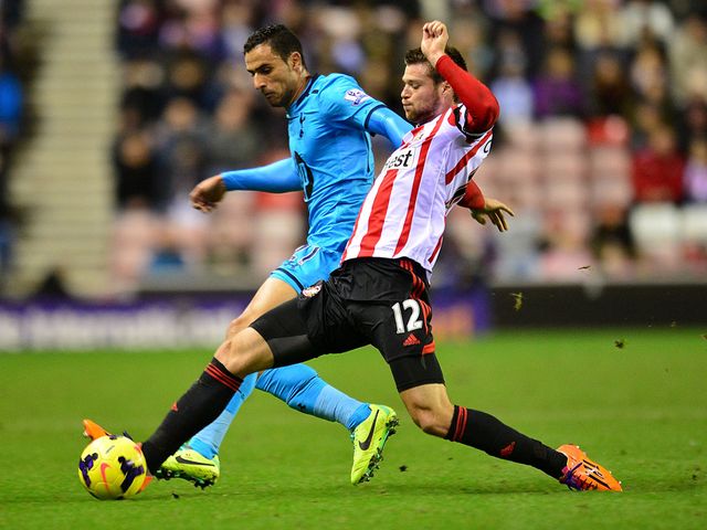 Nacer Chadli and Ondrej Celustka battle for the ball