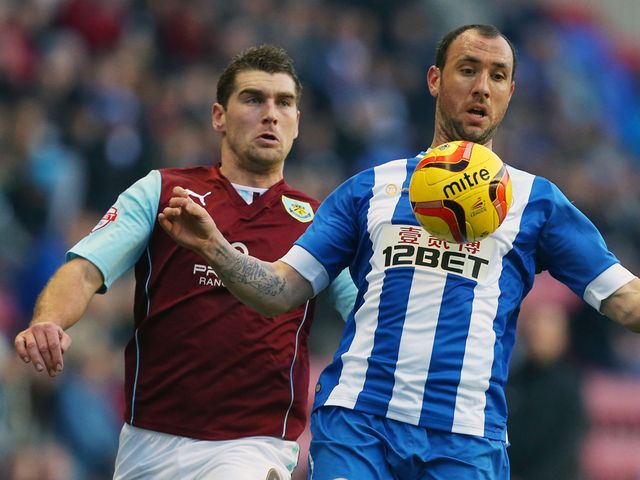 Ivan Ramis is watched by Sam Vokes