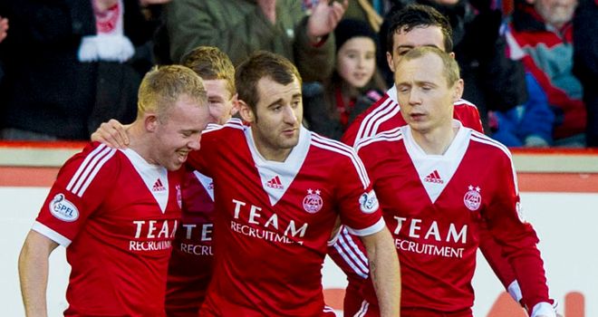 Nicky Low (L): Mobbed by his teammates after a stunning free-kick