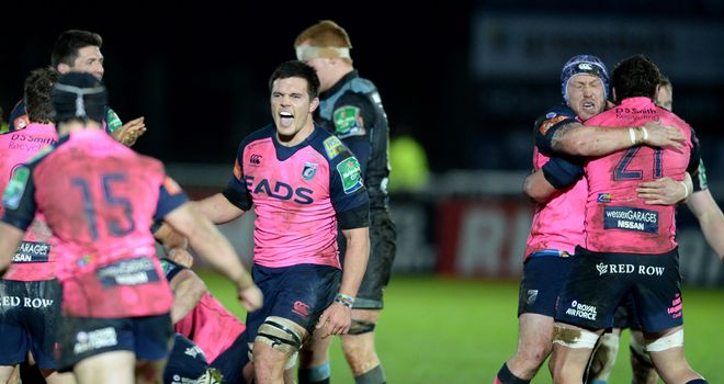The Cardiff Blues players celebrate after the final whistle