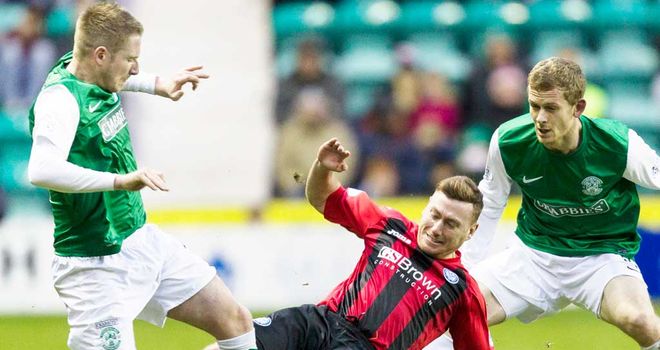 St Johnstone's Patrick Cregg (centre) goes over the top on Paul Cairney of Hibernian