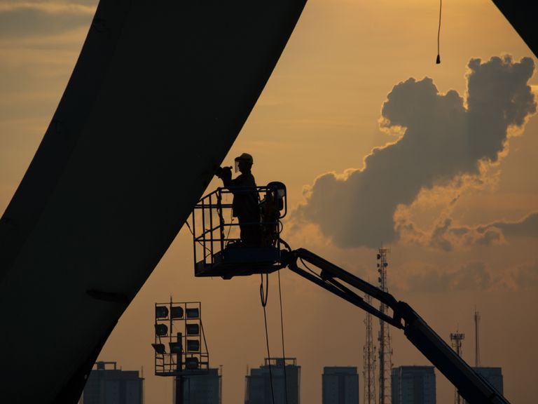 A man works at the Arena da Amazonia stadium, Manaus