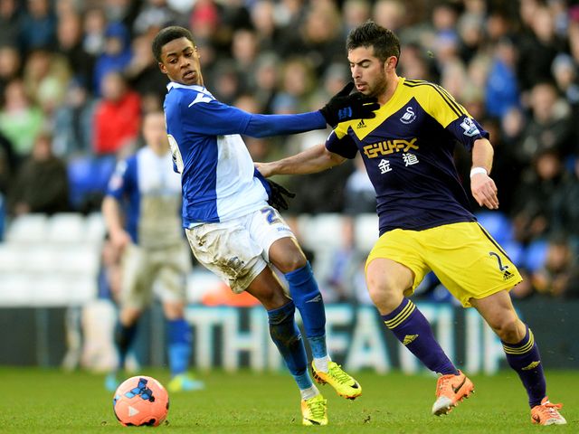 Reece Brown and Jordi Amat focus on the ball