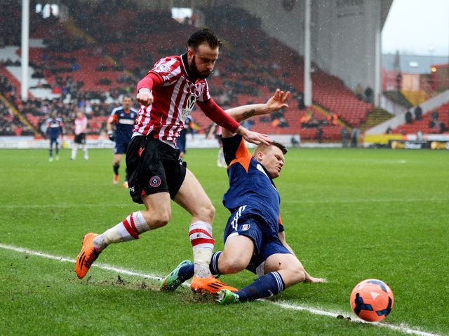 John Brayford is tackled by John Arne Riise