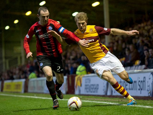 Dave Mackay and Henri Anier battle for possession.