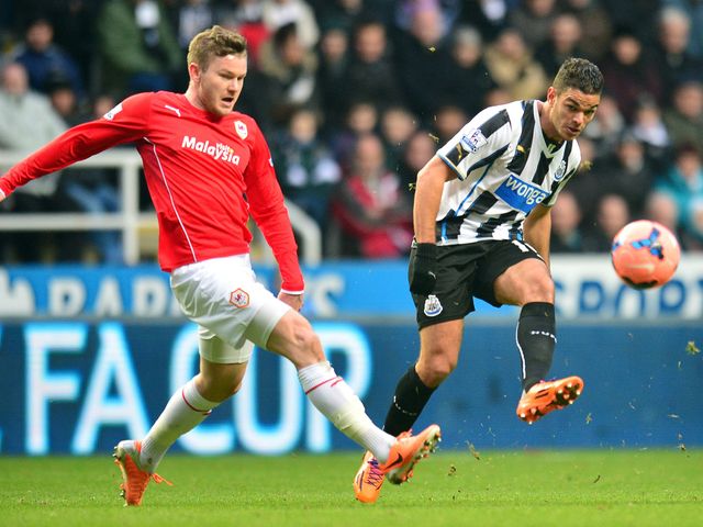 Newcastle's Hatem Ben Arfa (r) and Cardiff's Aron Gunnarson