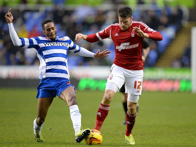 Jamie Mackie is tackled by Daniel Williams