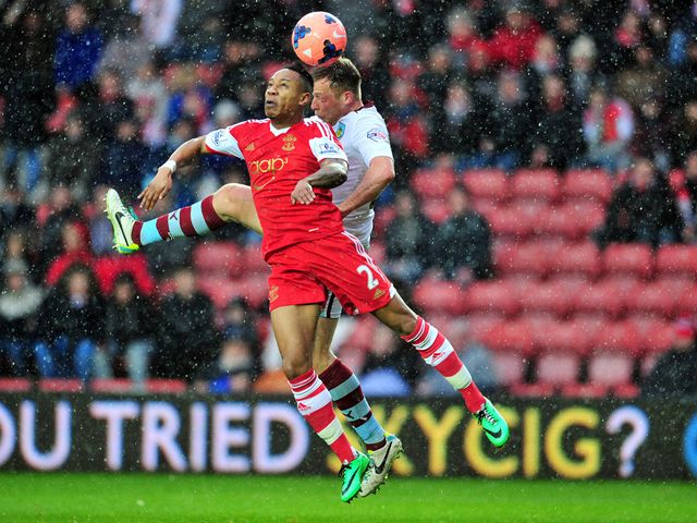 Nathaniel Clyne and Scott Arfield go for a high ball