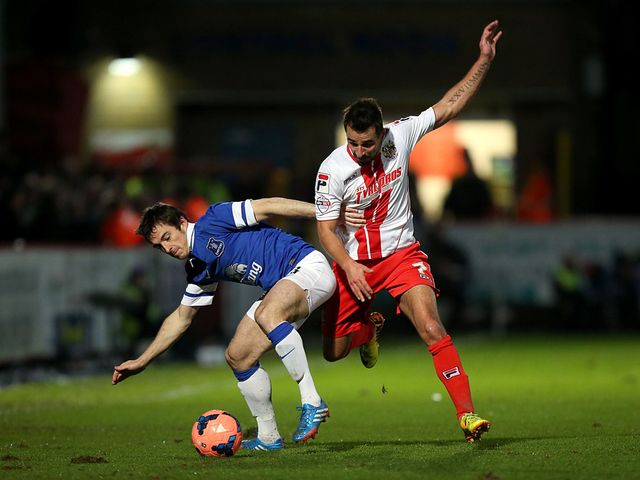 Leighton Baines keeps the ball away from Filipe Morais