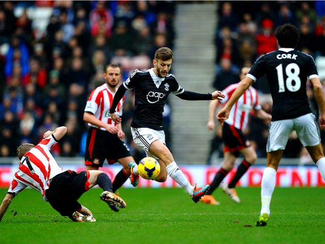 Adam Lallana makes space.
