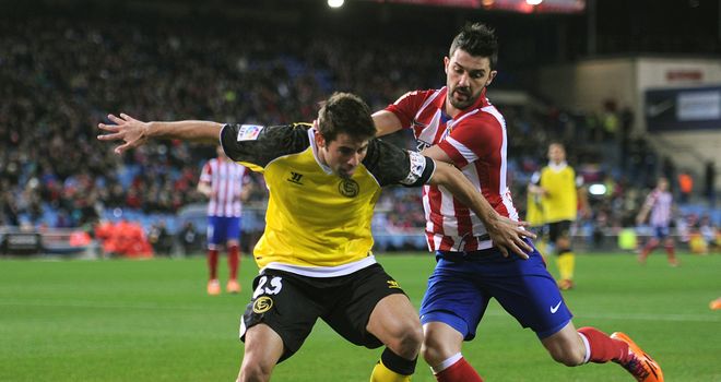 David Villa tries to keep the ball in play