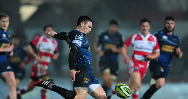 Kristian Phillips clears the ball for Scarlets