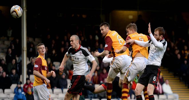 Stephen McManus heads Motherwell in front at Fir Park