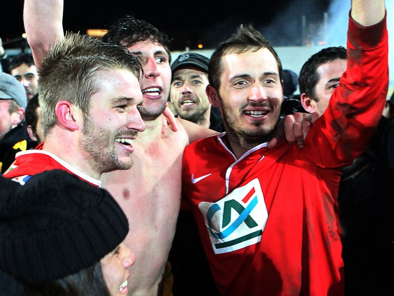 Ile Rousse's players celebrate after beating Bordeaux