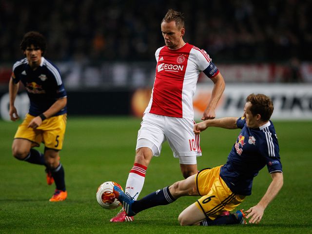 Siem De Jong of Ajax is tackled by Christian Schwegler of Salzburg