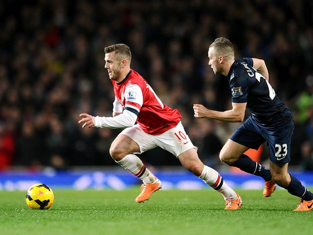 Jack Wilshere gets away from Tom Cleverley