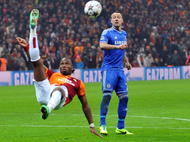 John Terry keeps an eye on Didier Drogba