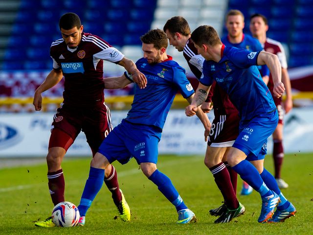 Hearts' Paul McCallum goes up against Ross Draper