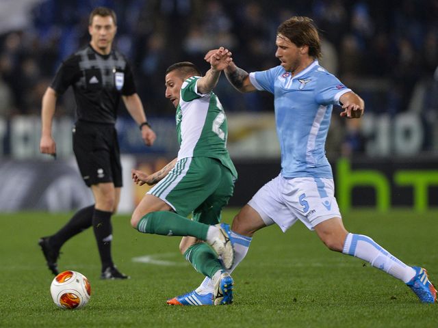 Lazio's Lucas Biglia fights for the ball against Hristo Zlatinski