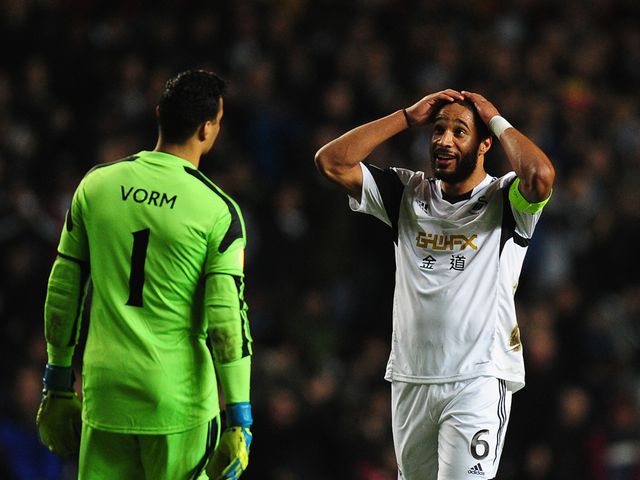 Ashley Williams and Michel Vorm react during the 0-0