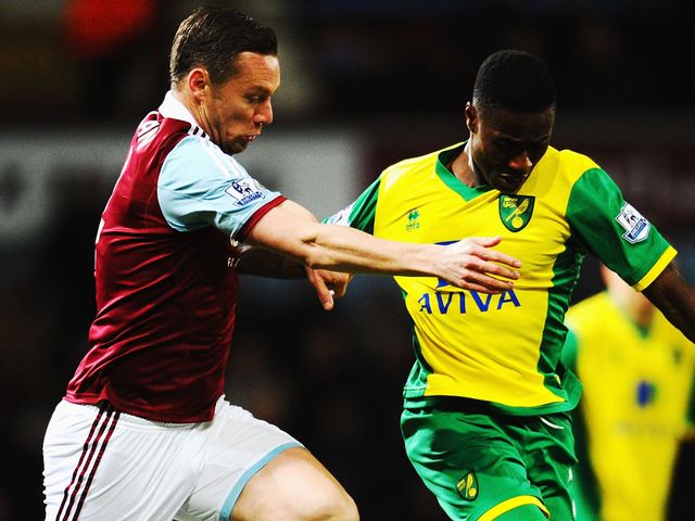 Kevin Nolan and Alexander Tettey battle for possession