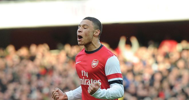 Alex Oxlade-Chamberlain: Celebrates after opening the scoring for Arsenal