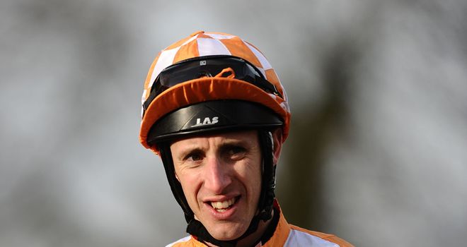 George Baker heads to the winner's enclosure after riding Galiotto