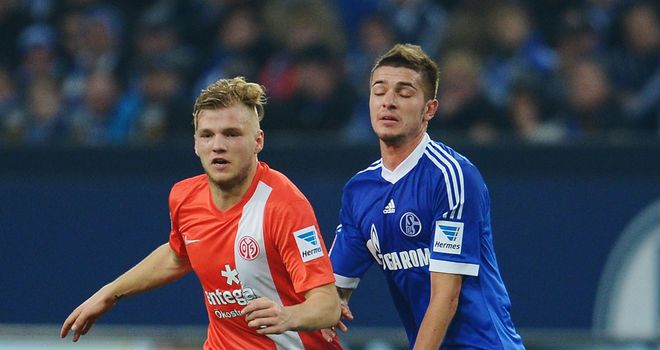 Max Meyer and Roman Neustaedter battle for the ball