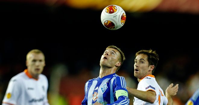 Andriy Yarmolenko (left) and Michel: Battle for the ball
