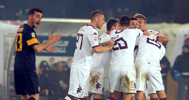 Alessio Cerci is mobbed after netting Torino's second