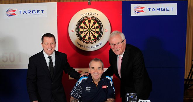 Phil Taylor: signs lucrative new deal alongside Target MD Garry Plummer and manager Barry Hearn