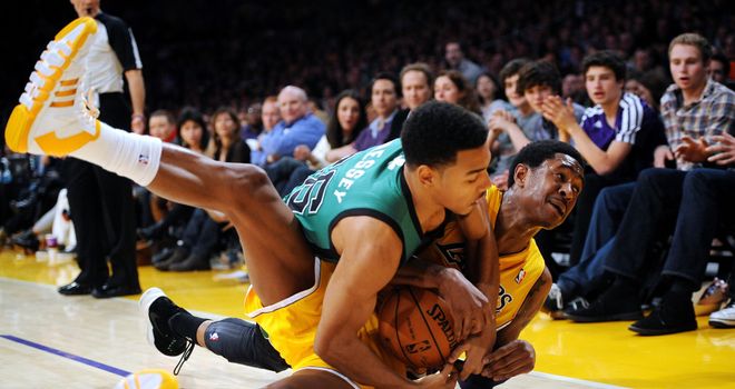 The Los Angeles Lakers' MarShon Brooks (R) and the Boston Celtics' Phil Pressey contest a loose ball