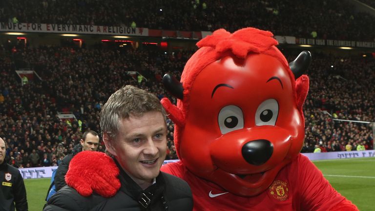 Ole Gunnar Solskjaer is enjoying Fred the Red's company, but Johnny is not a mascot fan