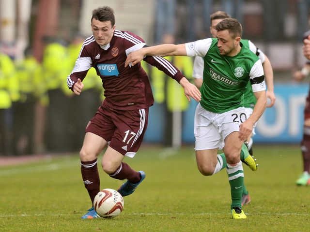 Hearts' David Smith (left) battles with Tom Taiwo