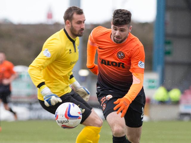 Nadir Ciftci rounds Dean Brill to score the opening goal