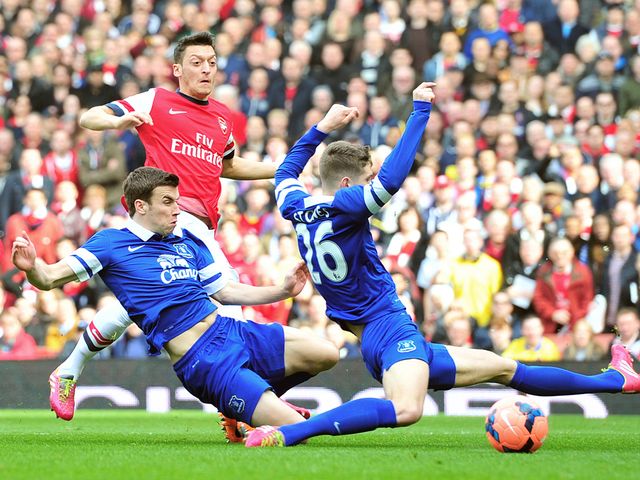 Mesut Ozil drills Arsenal into an early lead