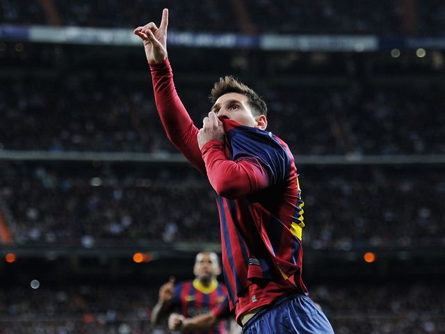 Lionel Messi celebrates scoring the winning goal