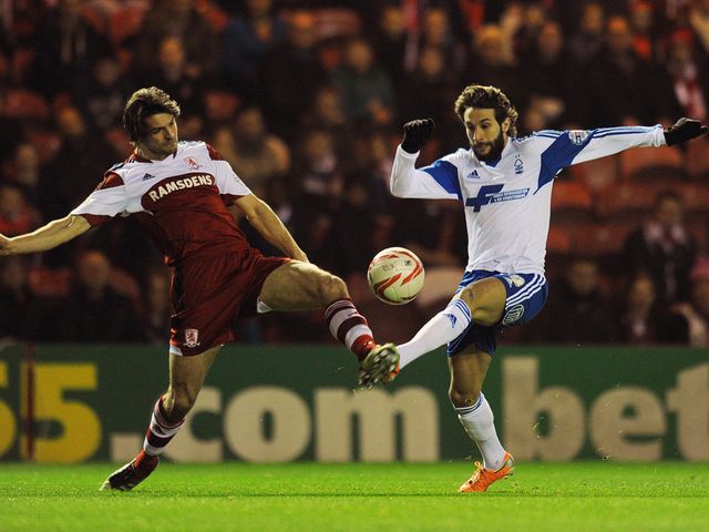 George Friend and Djamel Abdoun battle for the ball