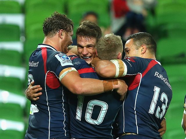 The Rebels celebrate during their victory