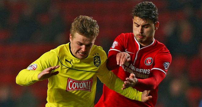 Charlton's Astrit Ajdarevic and Danny Ward of Huddersfield in action