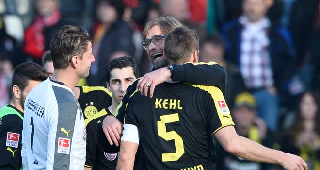 Dortmund boss Jurgen Klopp hugs Sebastian Kehl