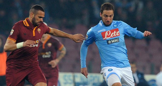Gonzalo Higuain fends off Leandro Castan