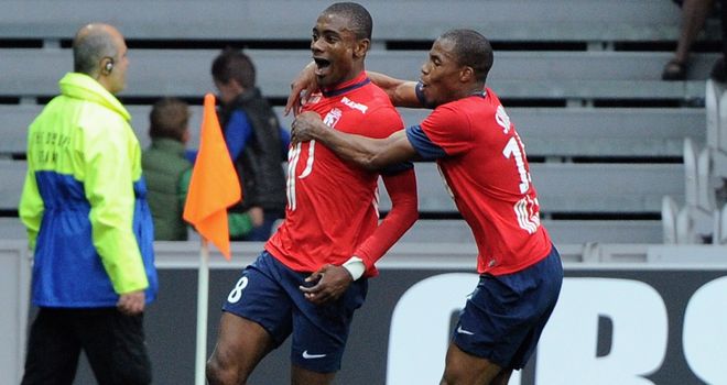 Salomon Kalou (left) celebrates are scoring at the death